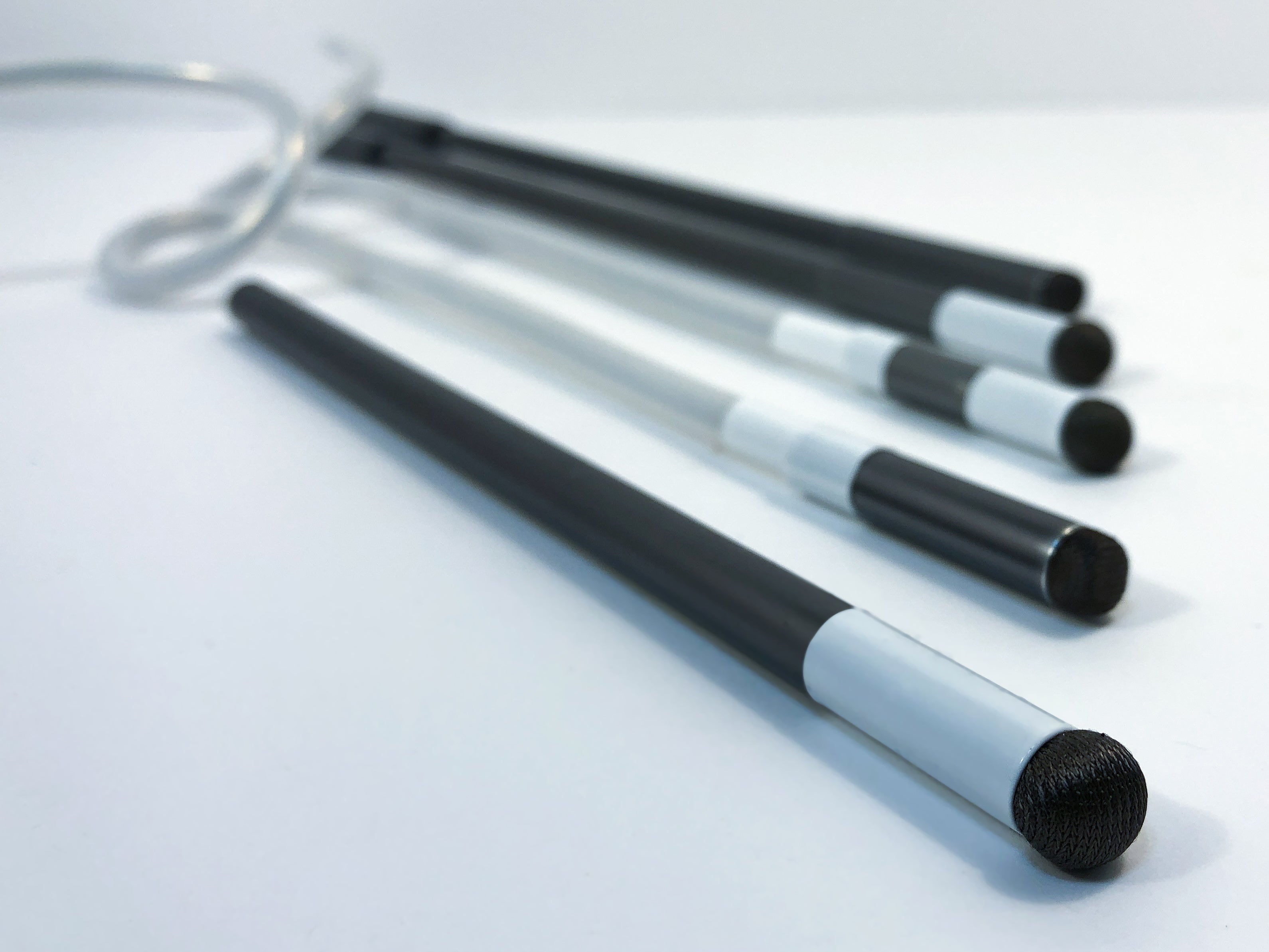 A dramatic image of the mouthstick styluses, bendable styluses, and handheld styluses. 